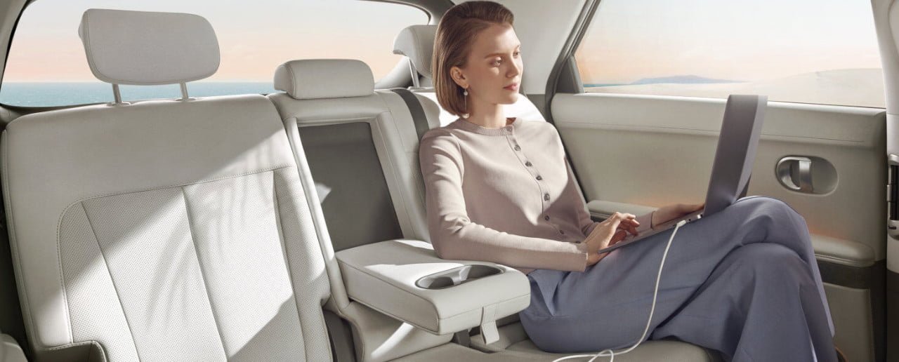 Executive travelling in chauffeur vehicle to Canary Wharf