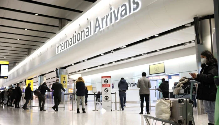 International traveller arriving in London with luggage